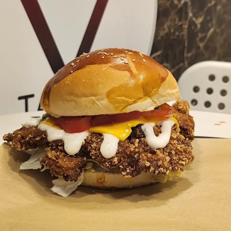 A Takagu Fried Chicken classic cheeseburger